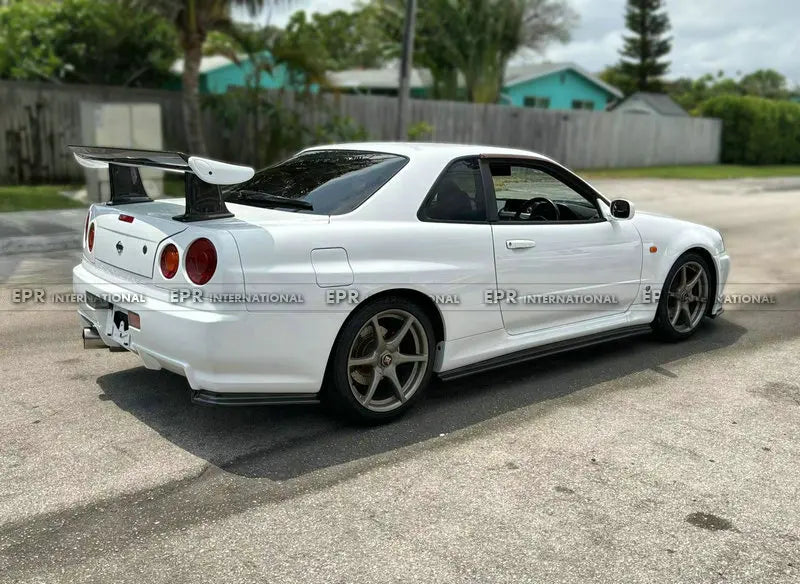For Nissan Skyline R34 GTR NIS Style Carbon Fiber Rear Spat Extensions - OEM Fit JDM