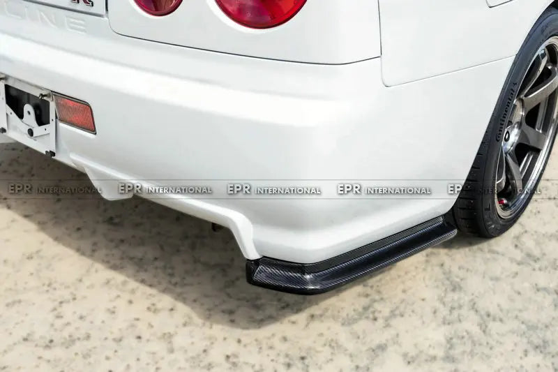 For Nissan Skyline R34 GTR NIS Style Carbon Fiber Rear Spat Extensions - OEM Fit JDM